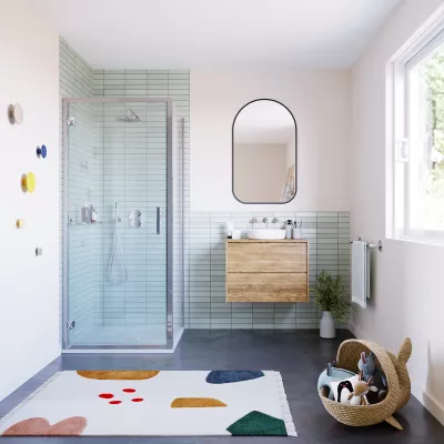 The ILI Hinge Door With Side Panel in a bathroom with lots of children's toys